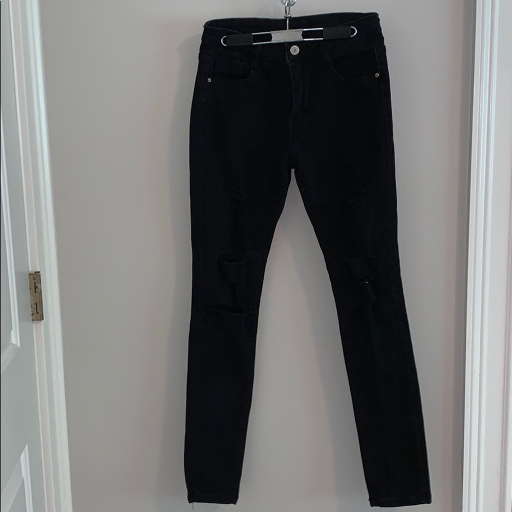 Black jeans with holes